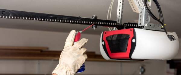 Demonstrating lubrication of the chain on a garage door opener