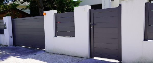 suburb home grey brown dark metal aluminum gate slats portal access house door