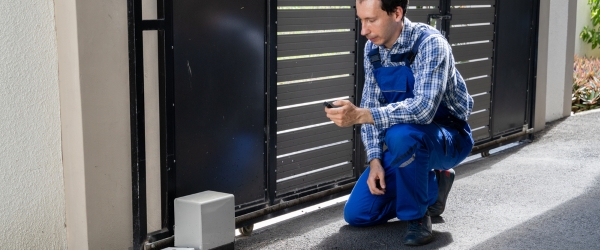 Repairman Fixing Broken Automatic Door