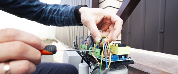 Technician man installing and checking the function of automatic